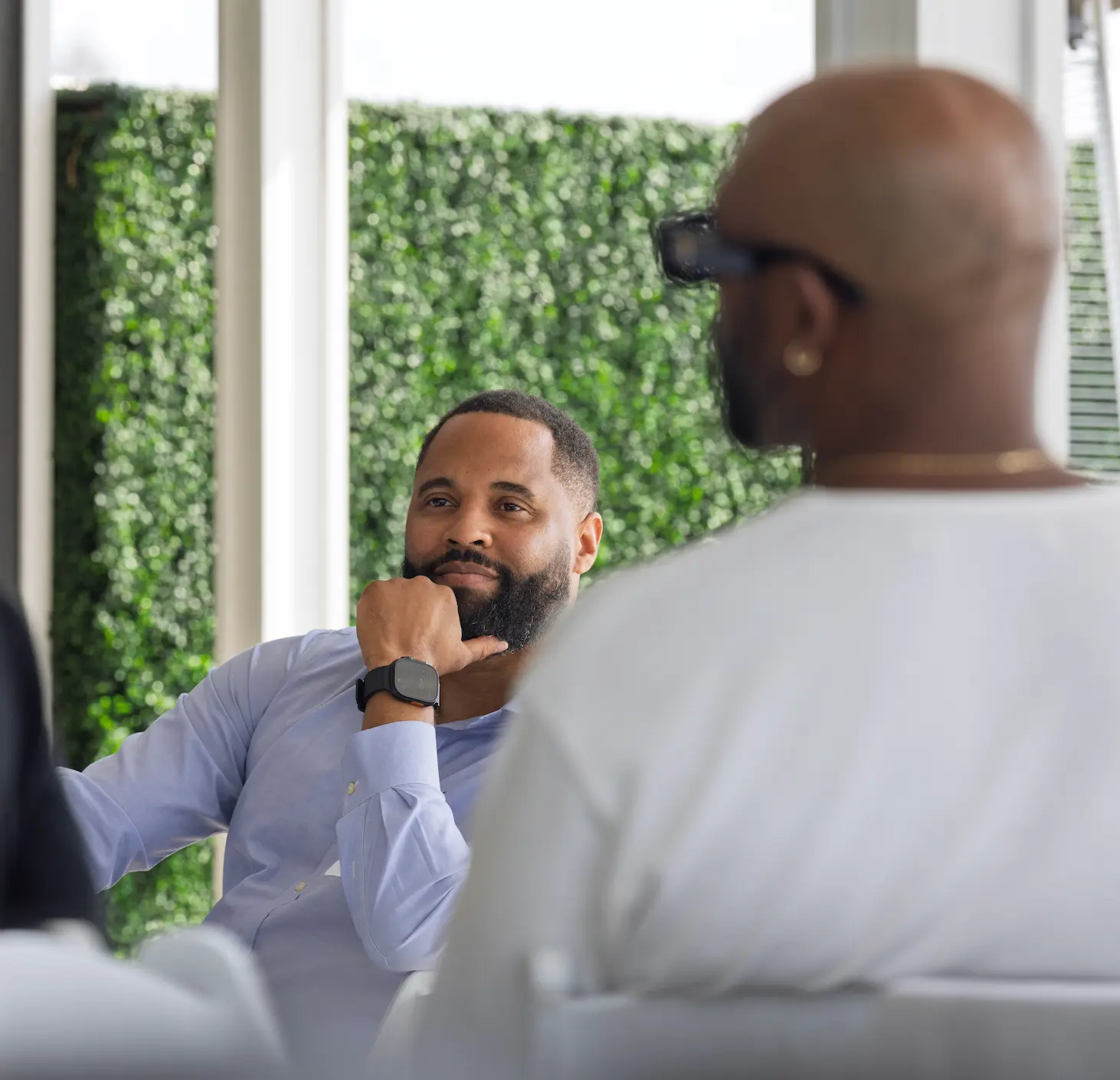 A guest listening intently during the breakfast conversation